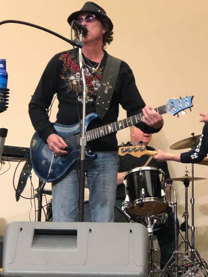 Johnny Morse playing guitar. Photo by Judith Hawkins.